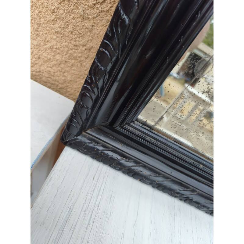 Black lacquered wood mirror "originally punctured"