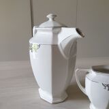Old coffee maker and its milk pot