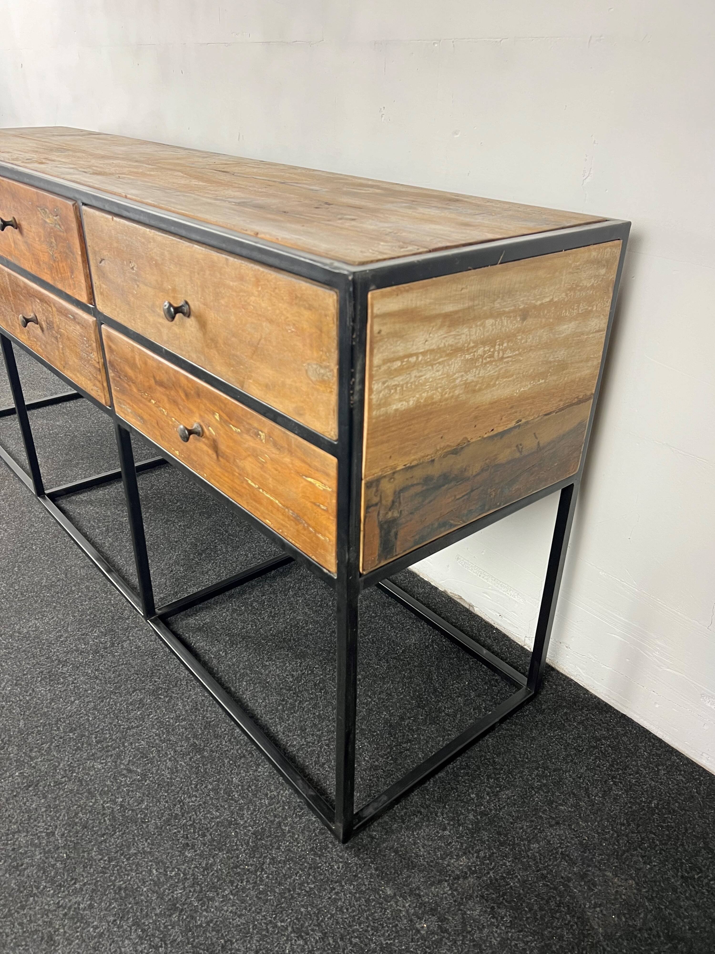 Antique wooden console with black metal base and 6 drawers
