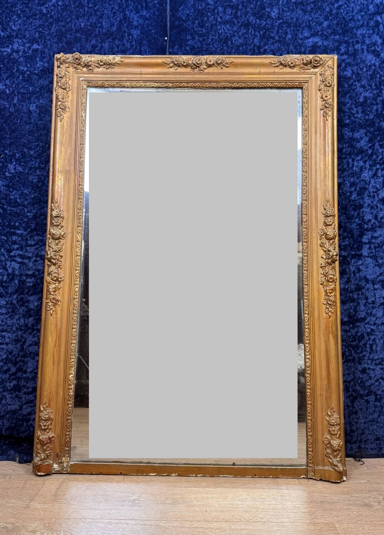 Empire period mirror in wood and gilded stucco circa 1810-1820