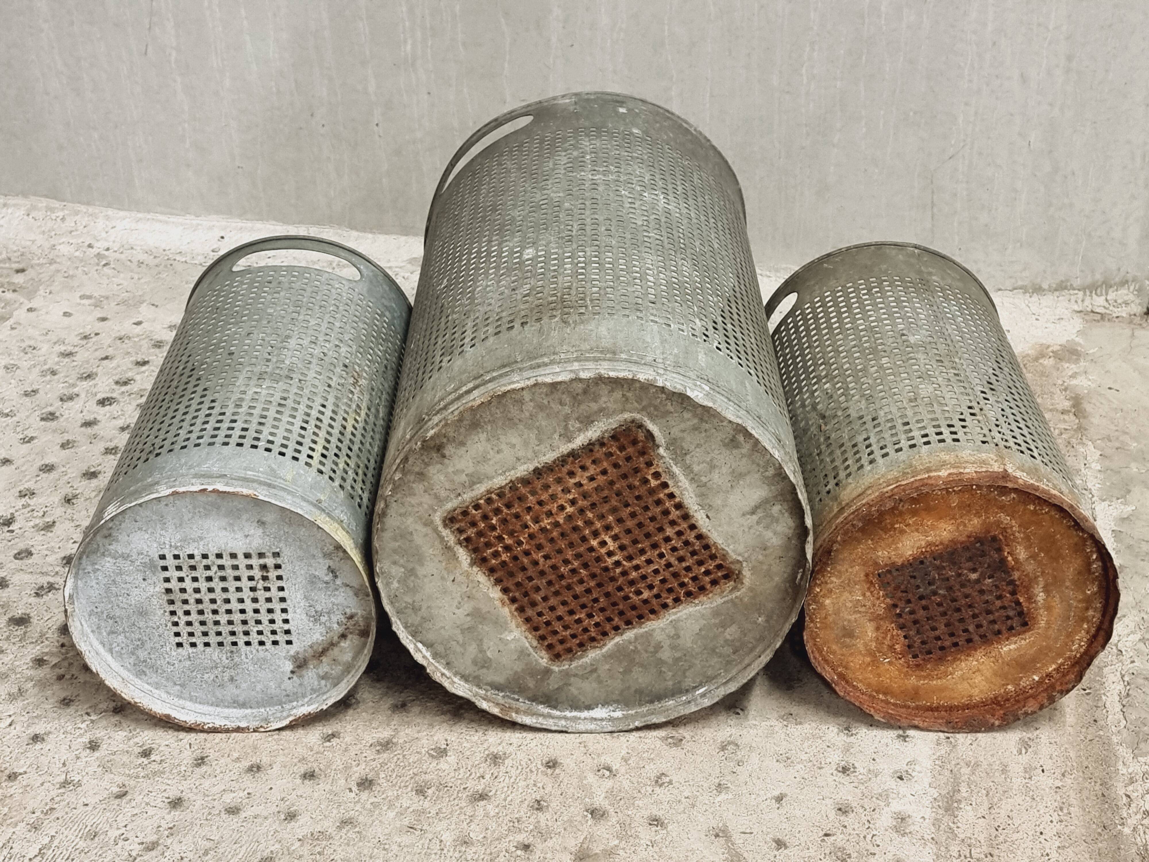 Vintage set of perforated metal waste bins