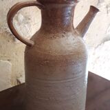 Vintage kid jug in two-tone sandstone with a handle and spout