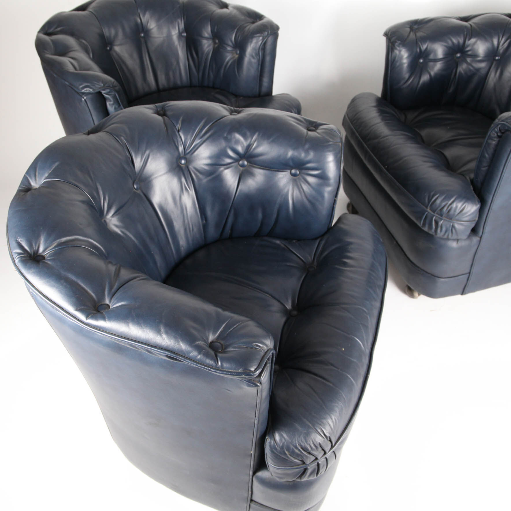 Suite of 3 small armchairs in midnight blue leather with castors
