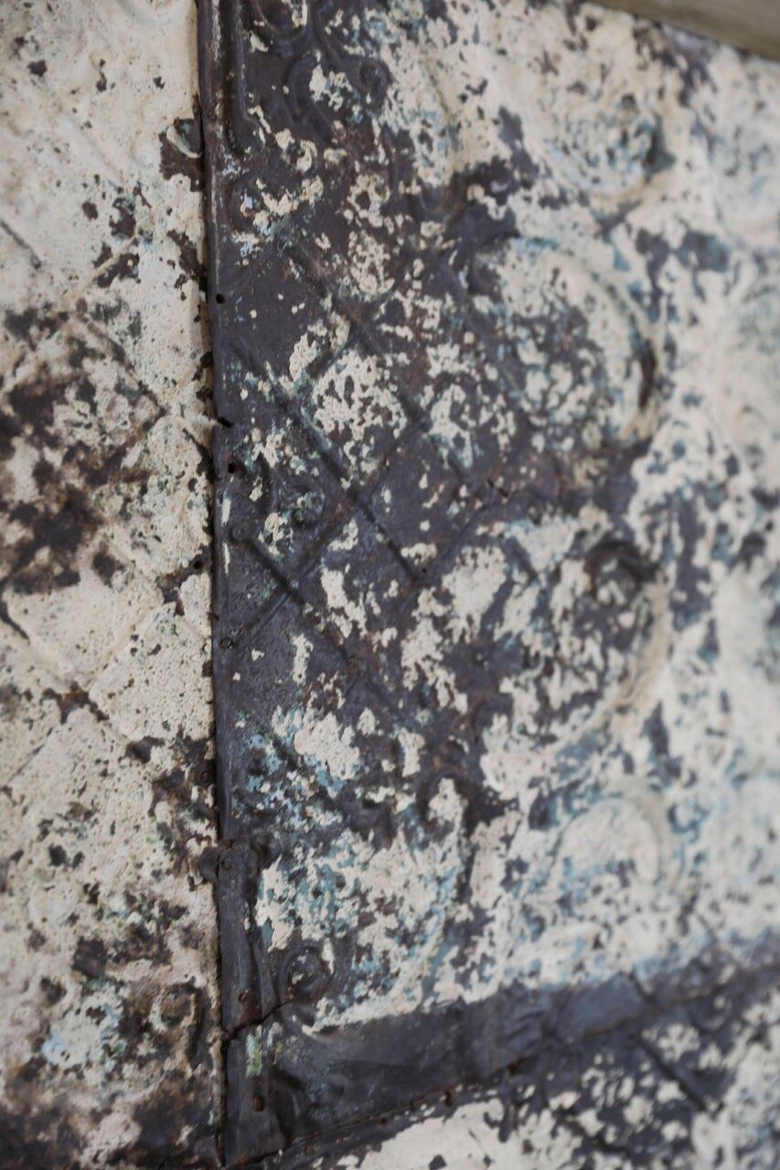 Decorative panel with patinated metal and wood