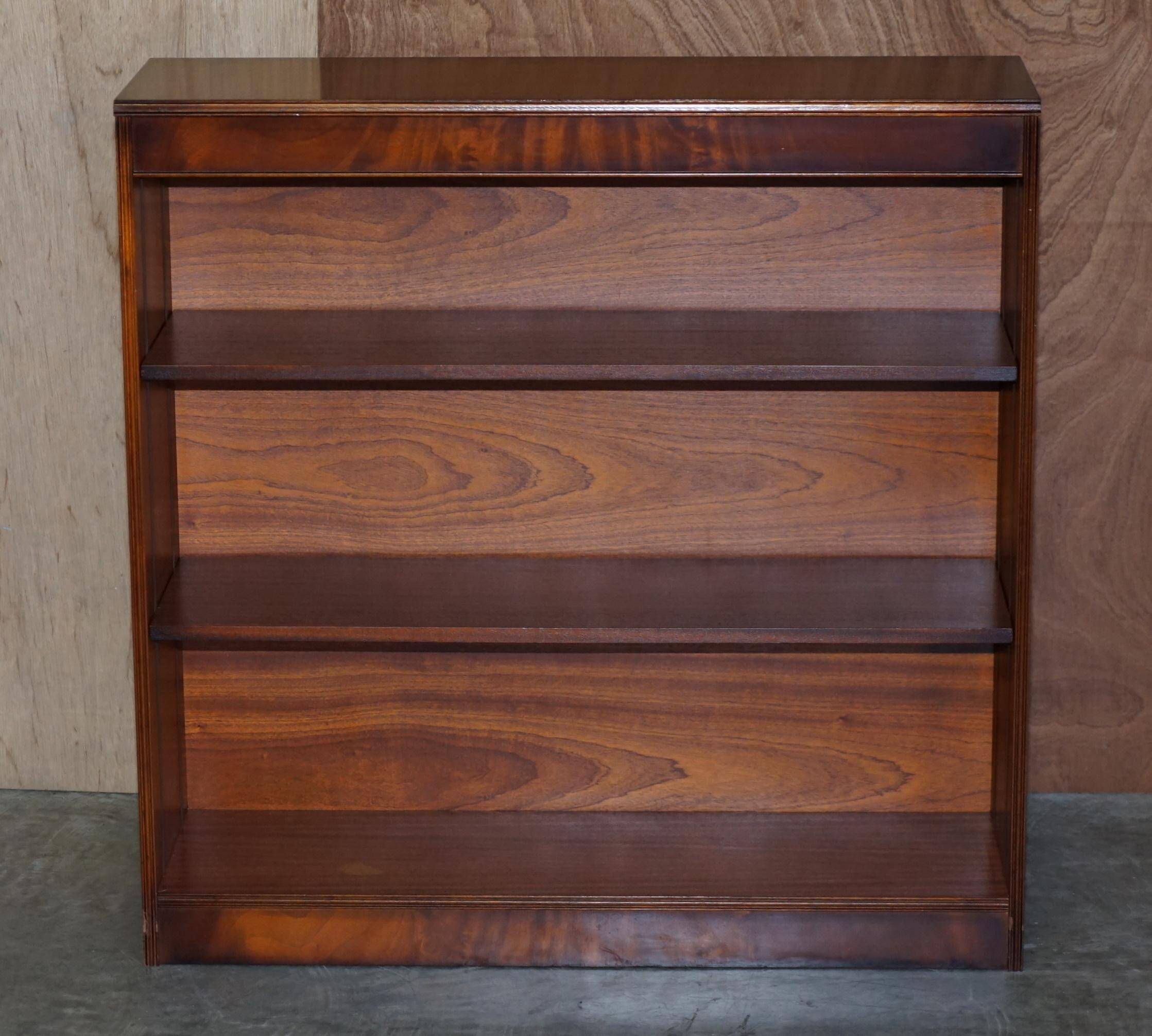 Pair of open dwarf bookshelves in mahogany by Shaws of London.