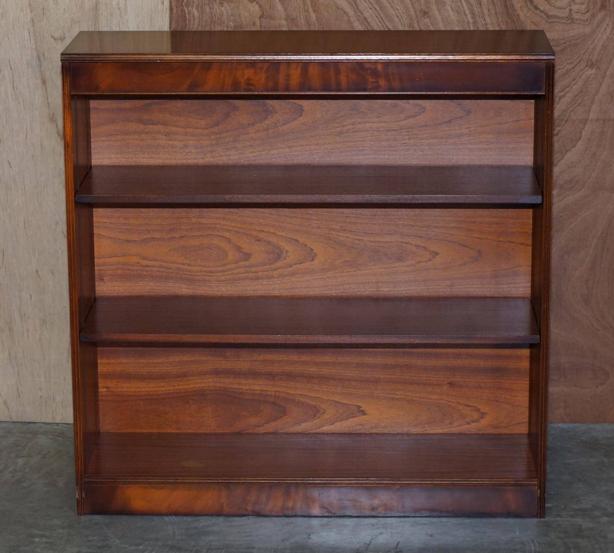 Pair of open dwarf bookshelves in mahogany by Shaws of London.