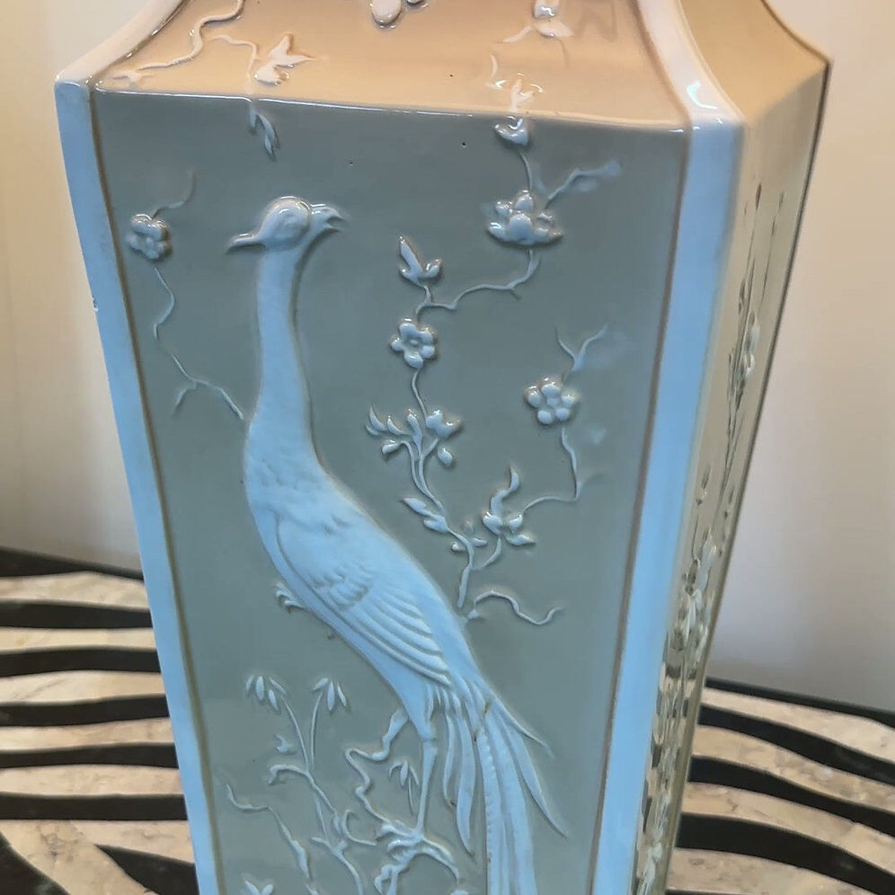 Pair of large cream ceramic table lamps with relief peacocks and fabric shades