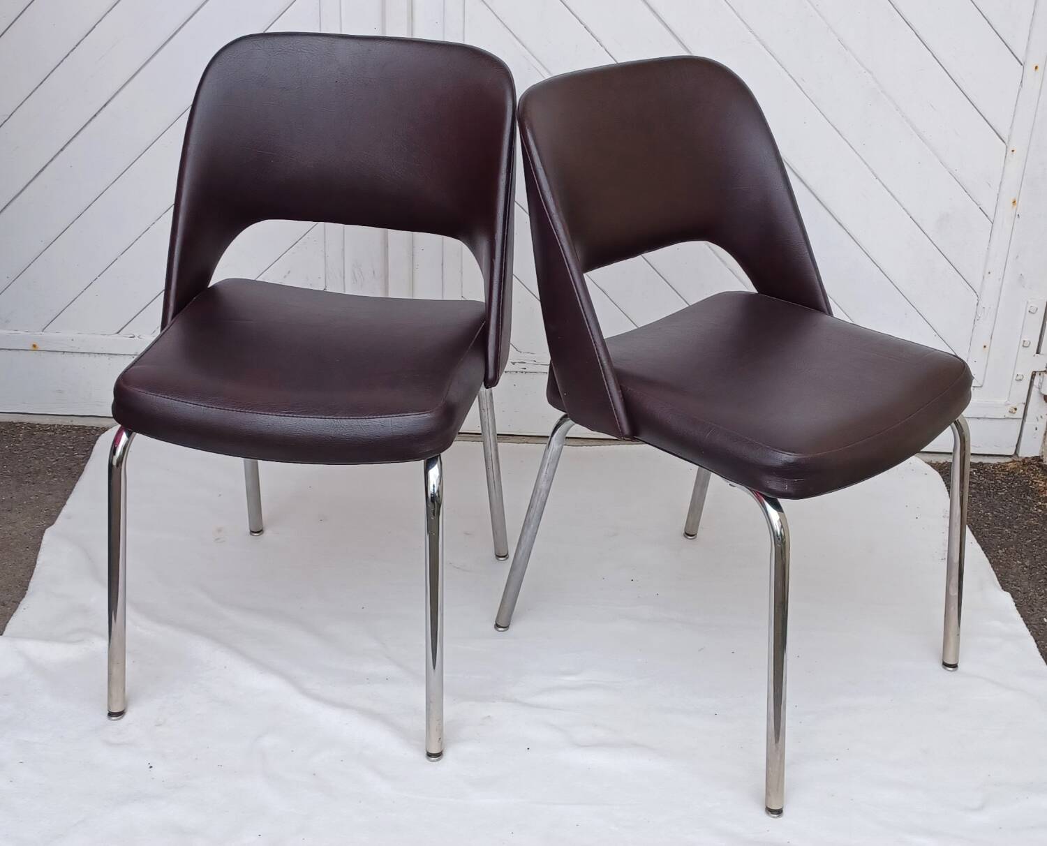 Pair of vintage faux leather and chrome armchairs