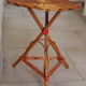Tripod rattan side table / guéridon from the 1960s-1970s.