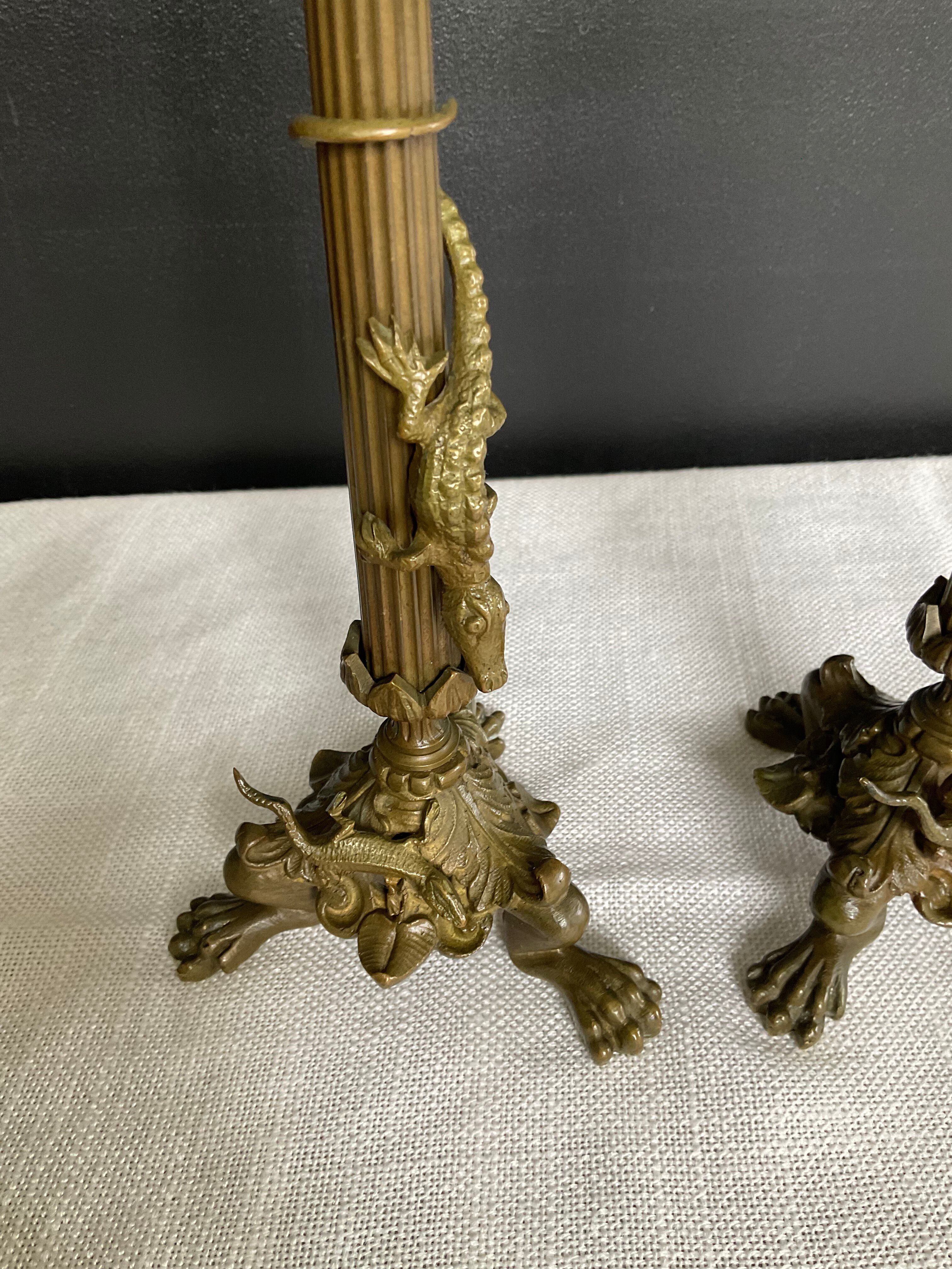Pair of 19th-century gilded bronze candlesticks in Empire style.
