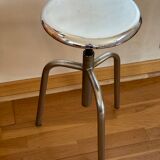Chrome screw stool of hairdresser workshop