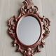 Classic red and gold patinated rocaille mirror, 35 cm x 23 cm