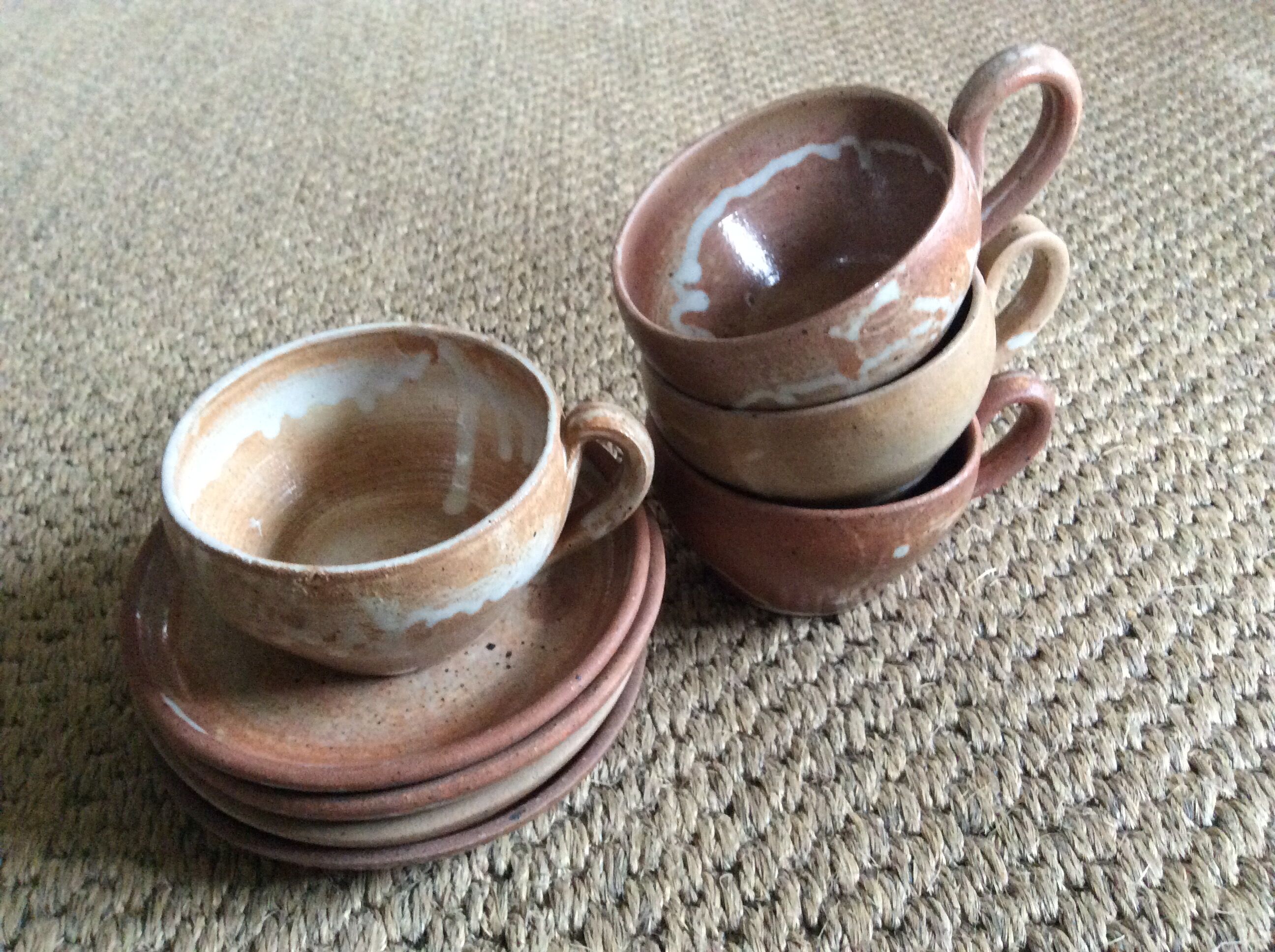 Series of 4 stoneware coffee cups