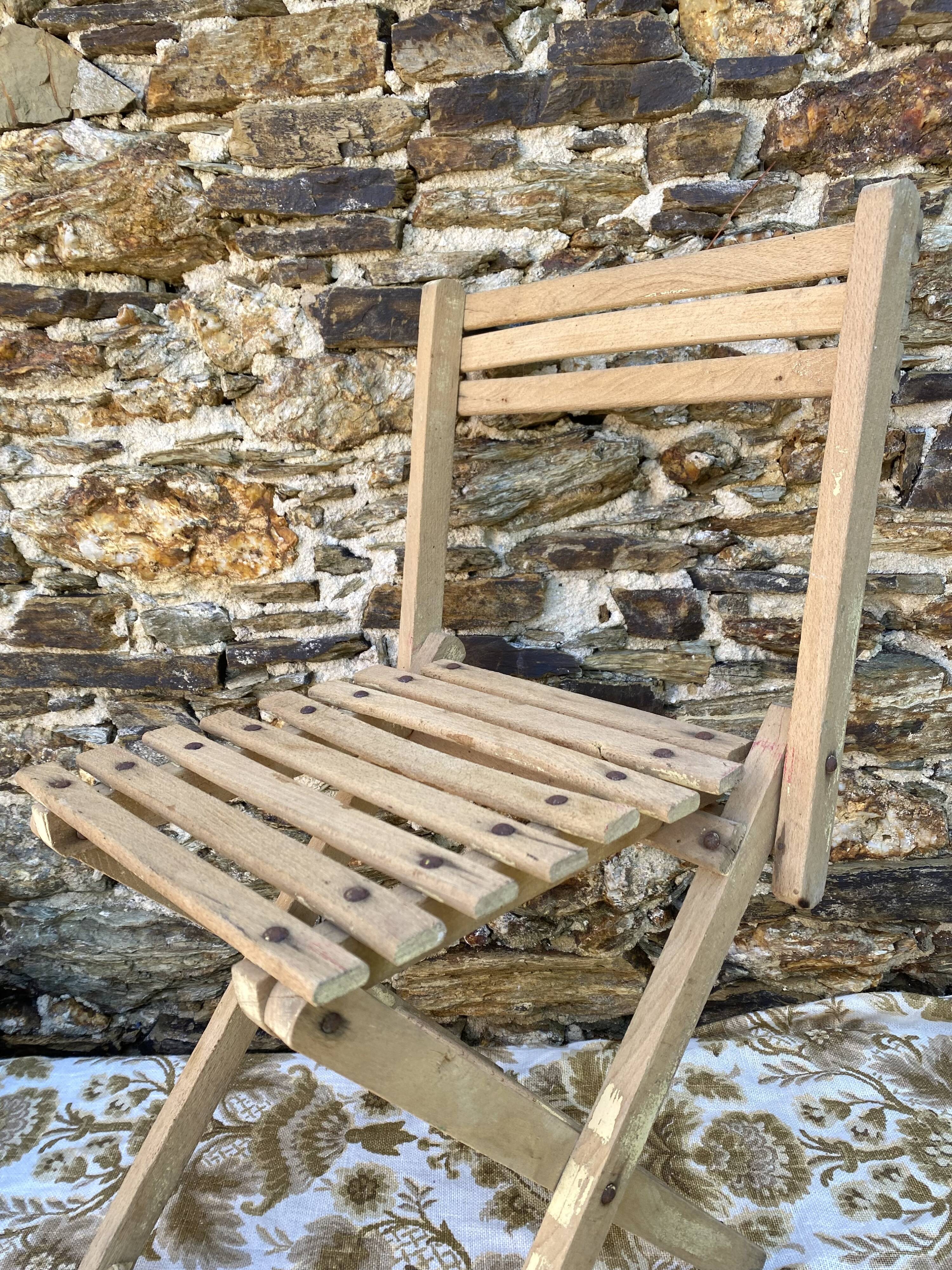 Antique folding chair with wooden slats