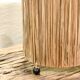Cylindrical lamp in natural raffia