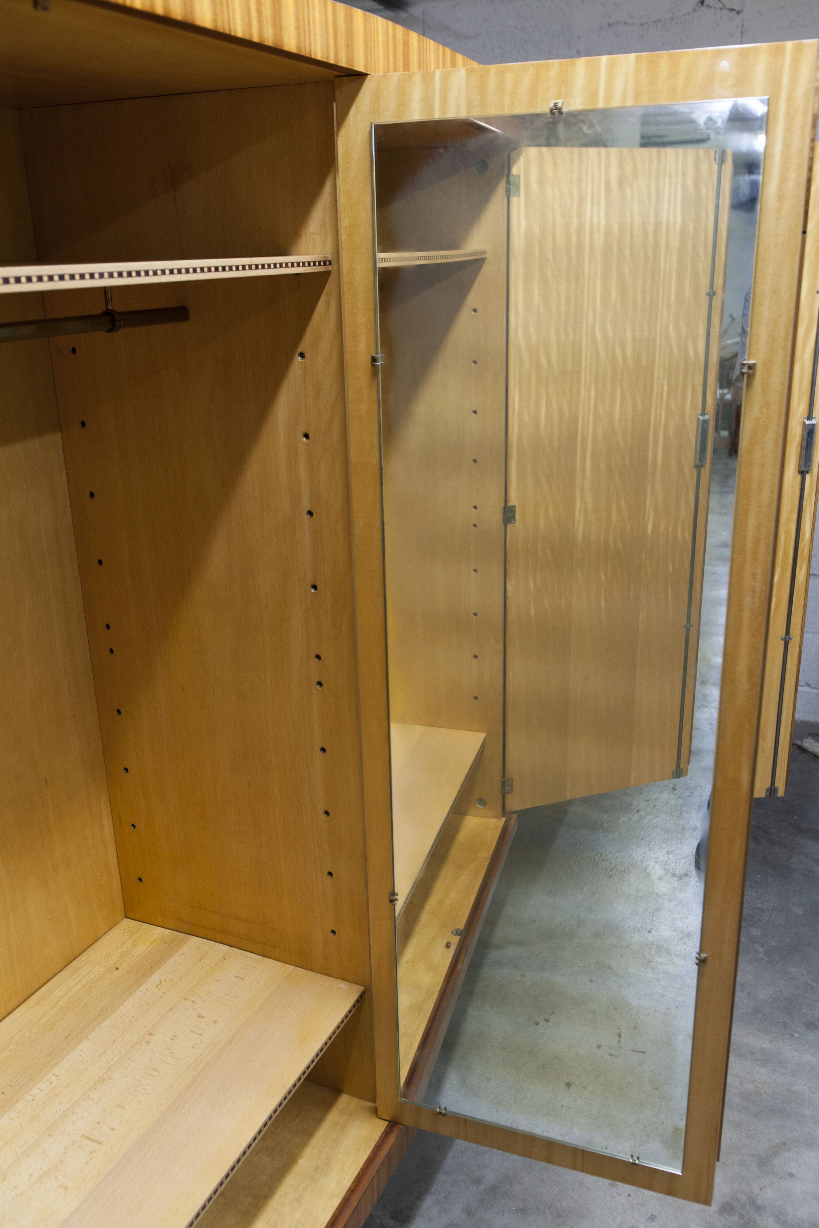 1960s Scandinavian wardrobe, blonde varnished wood, unusual, 4 doors, 3 drawers, 7 shelves.