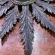 Metal mirror with foliage decoration