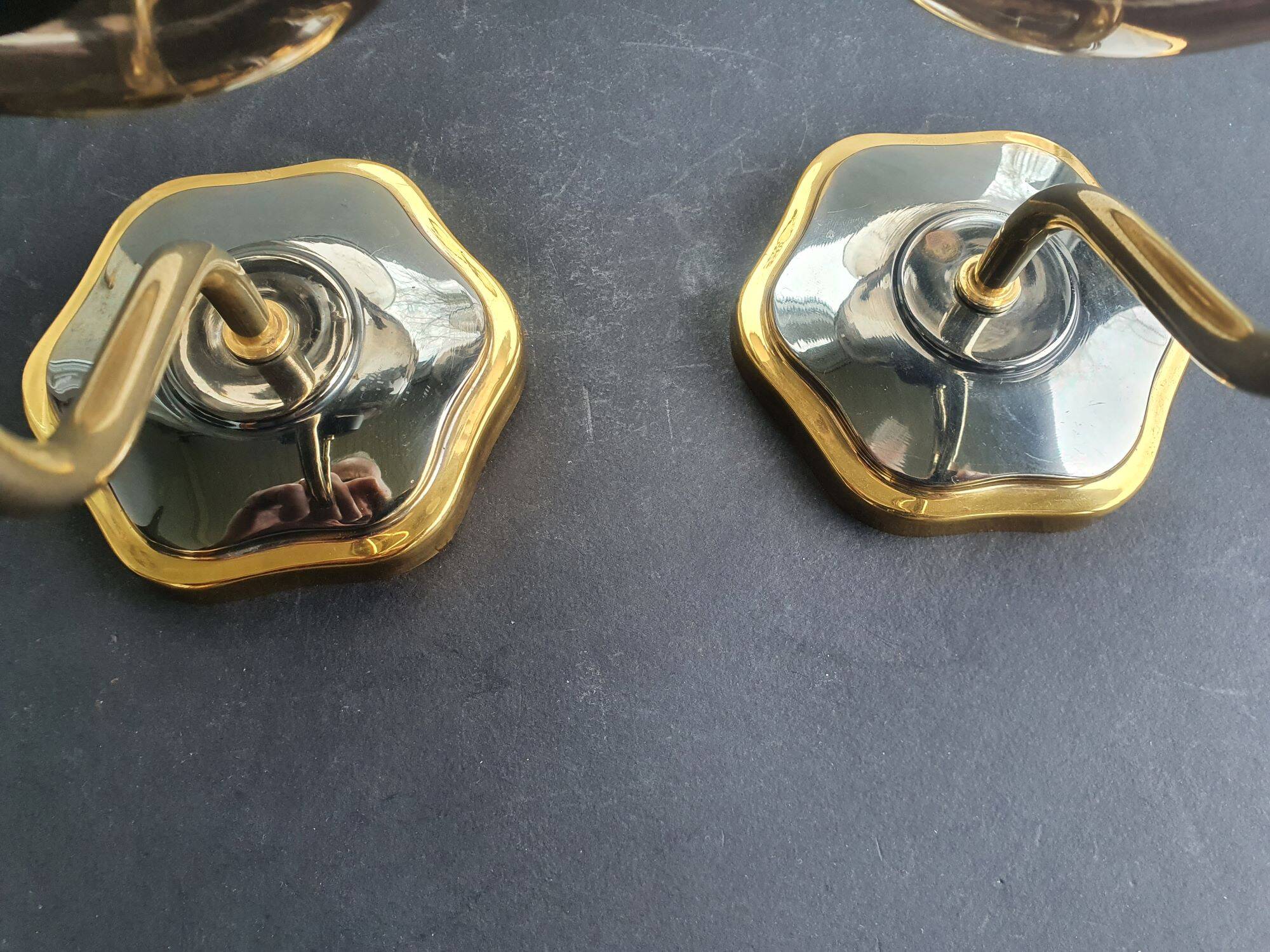 Pair of antique gold-plated brass and smoked glass wall lights.