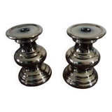 Two bronze-colored candlesticks