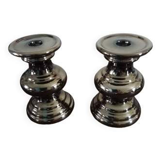 Two bronze-colored candlesticks