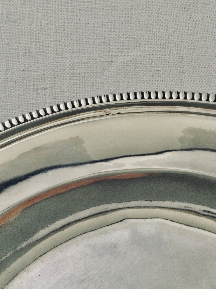 Solid silver dish with old man