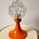 Space age lamp in orange glass and metal, around 1960.