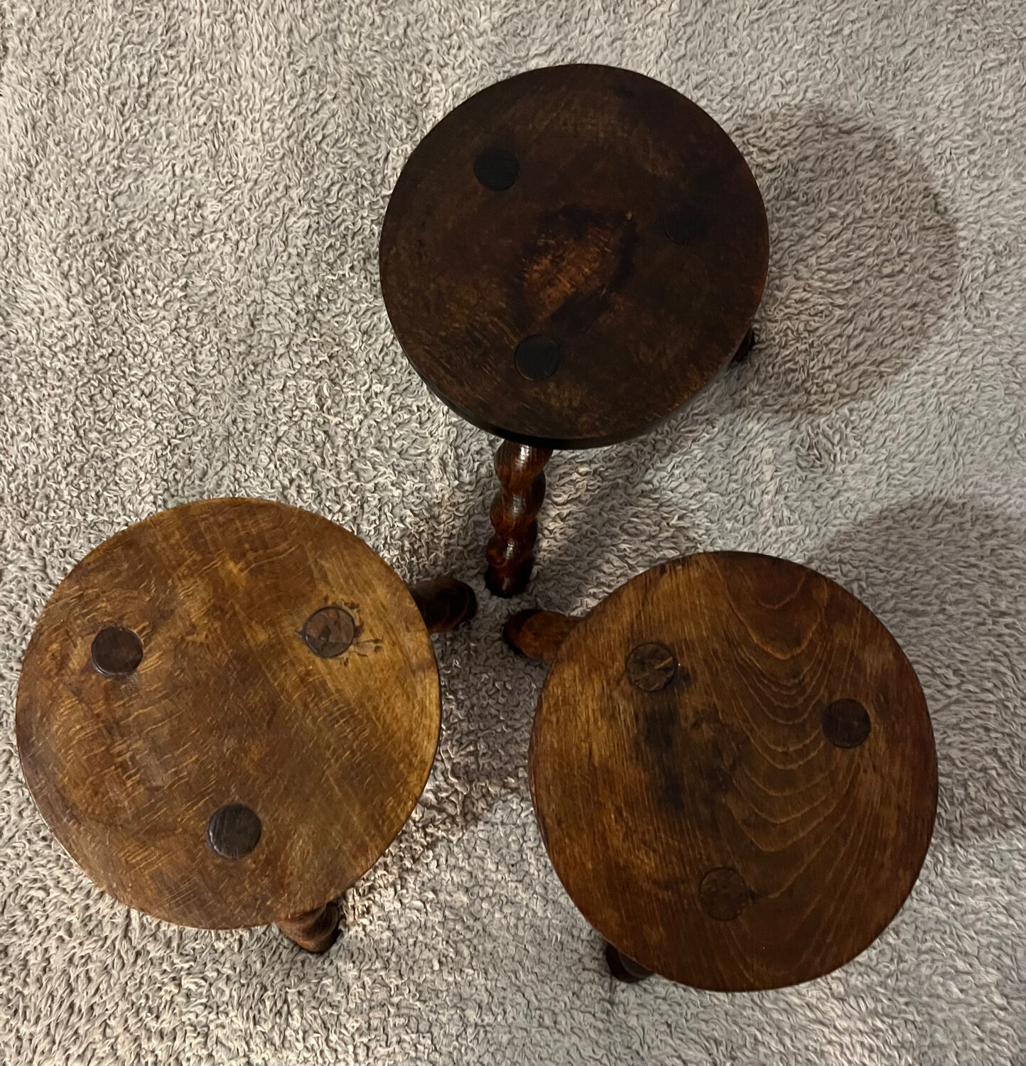Wooden tripod stool with twisted legs
