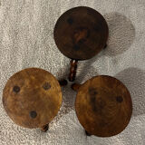 Wooden tripod stool with twisted legs