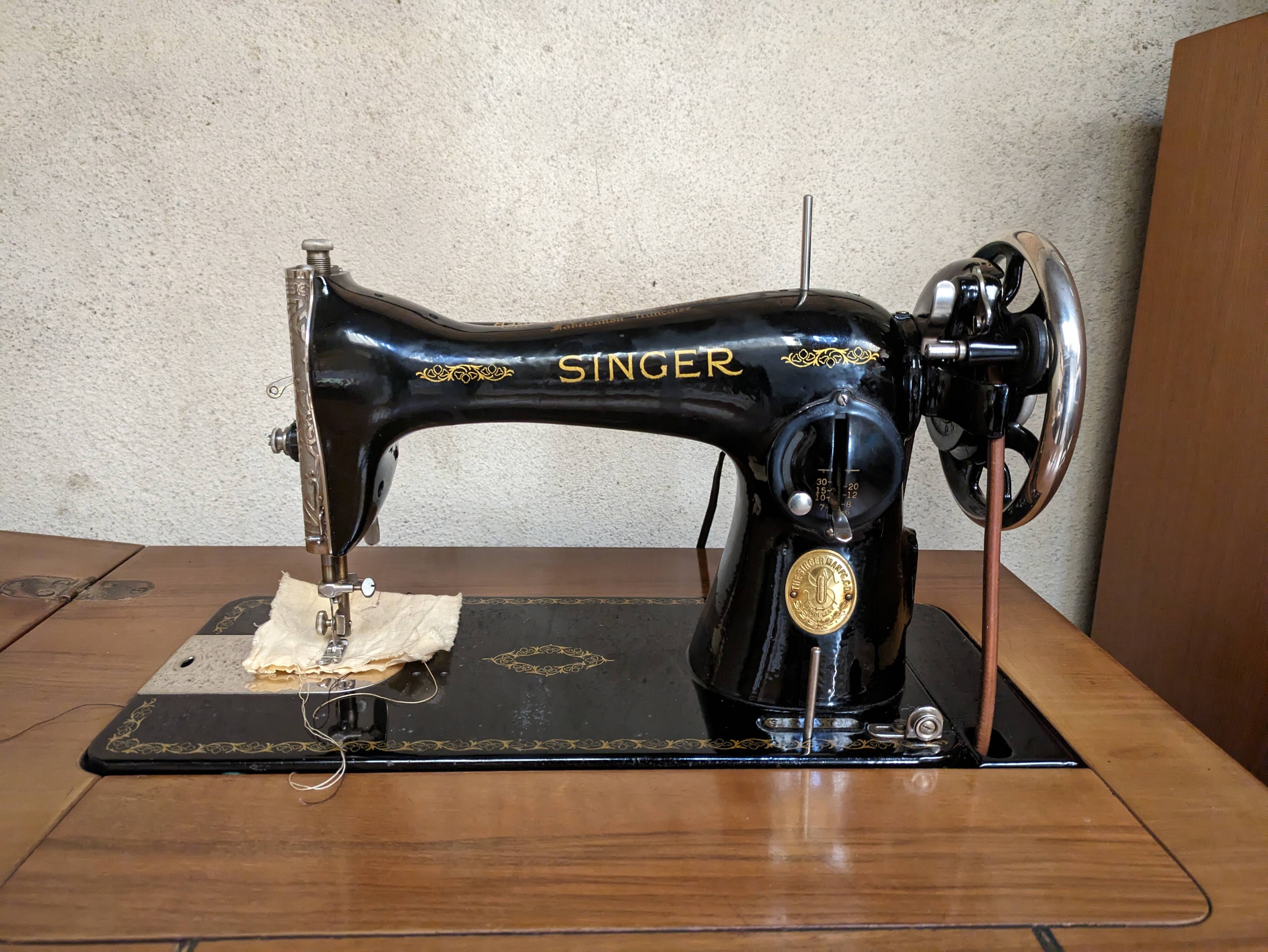 Singer sewing machine in its cabinet