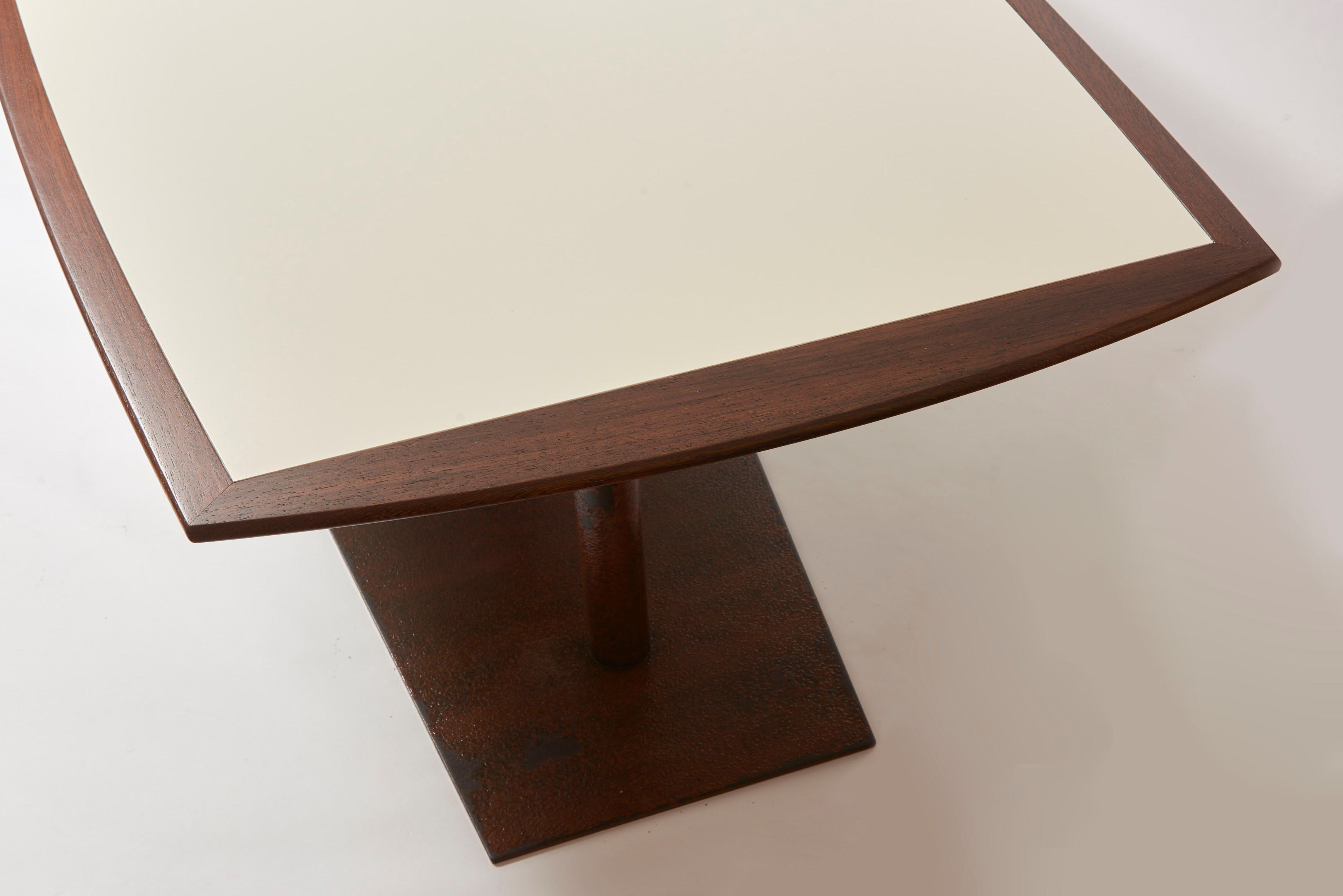 Brutalist conference table made of wood and steel