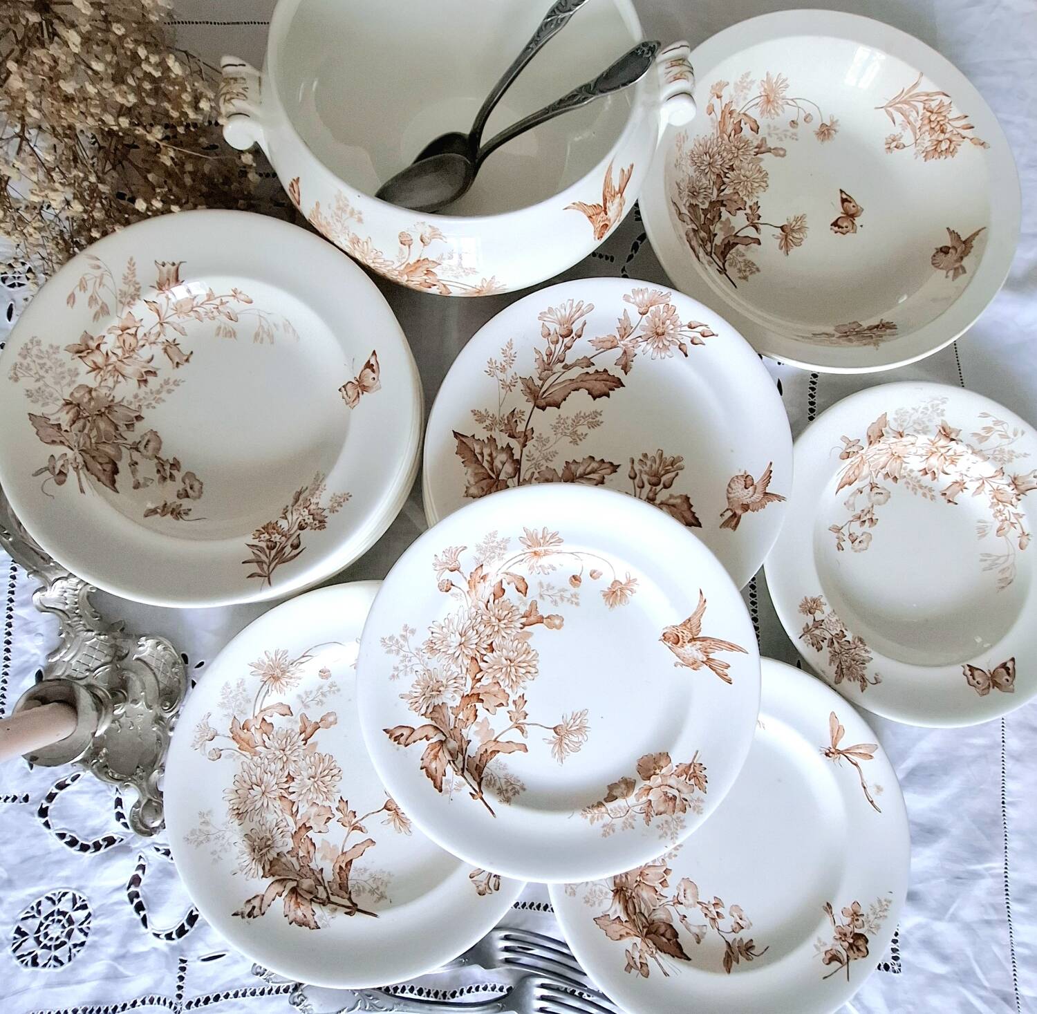 Antique iron earthenware plates accompanied by dishes