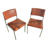 A pair of vintage brown Skaï chairs.