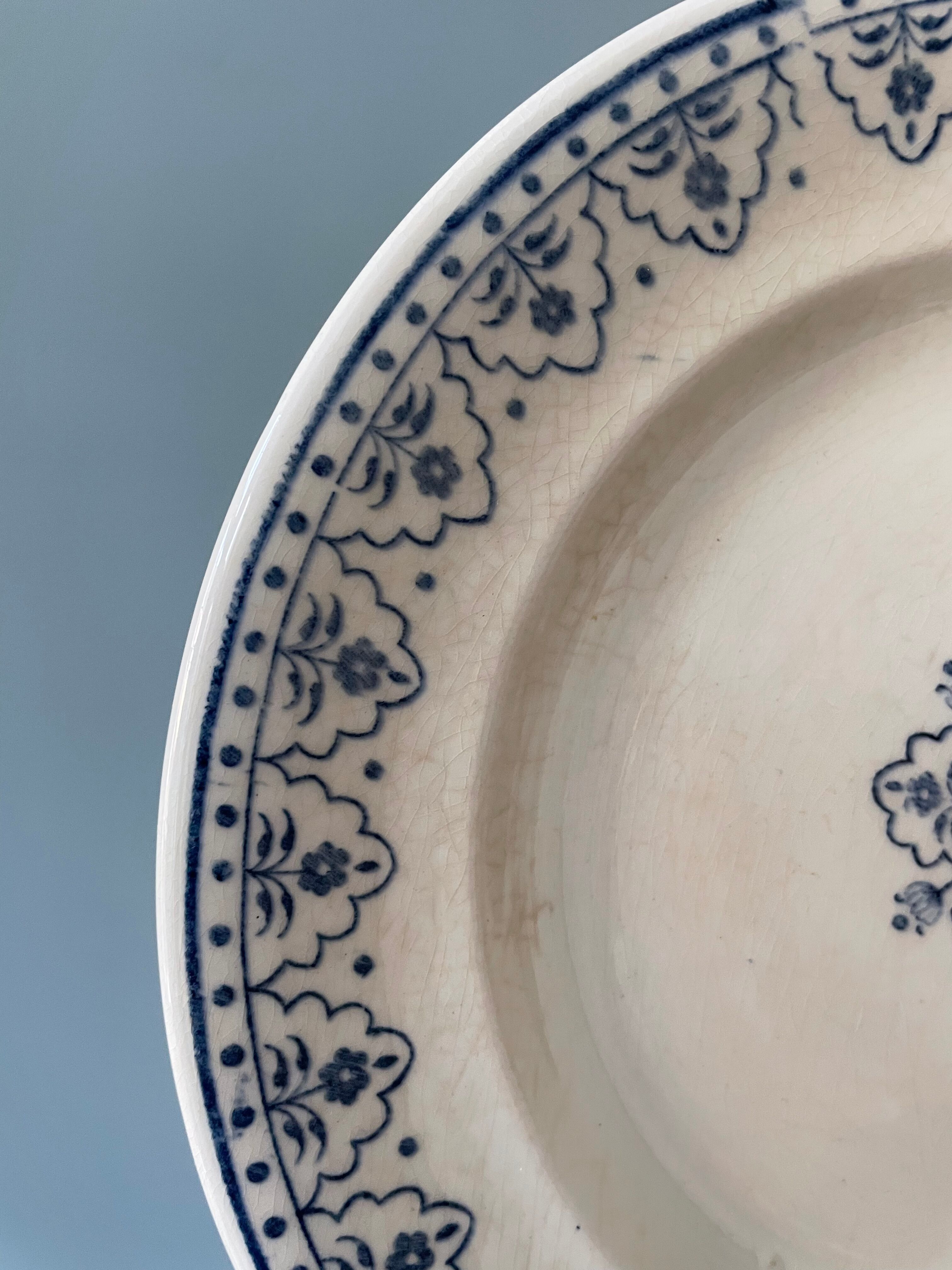 Series of 12 flat plates XIXth earthenware Terre de Fer Clairefontaine