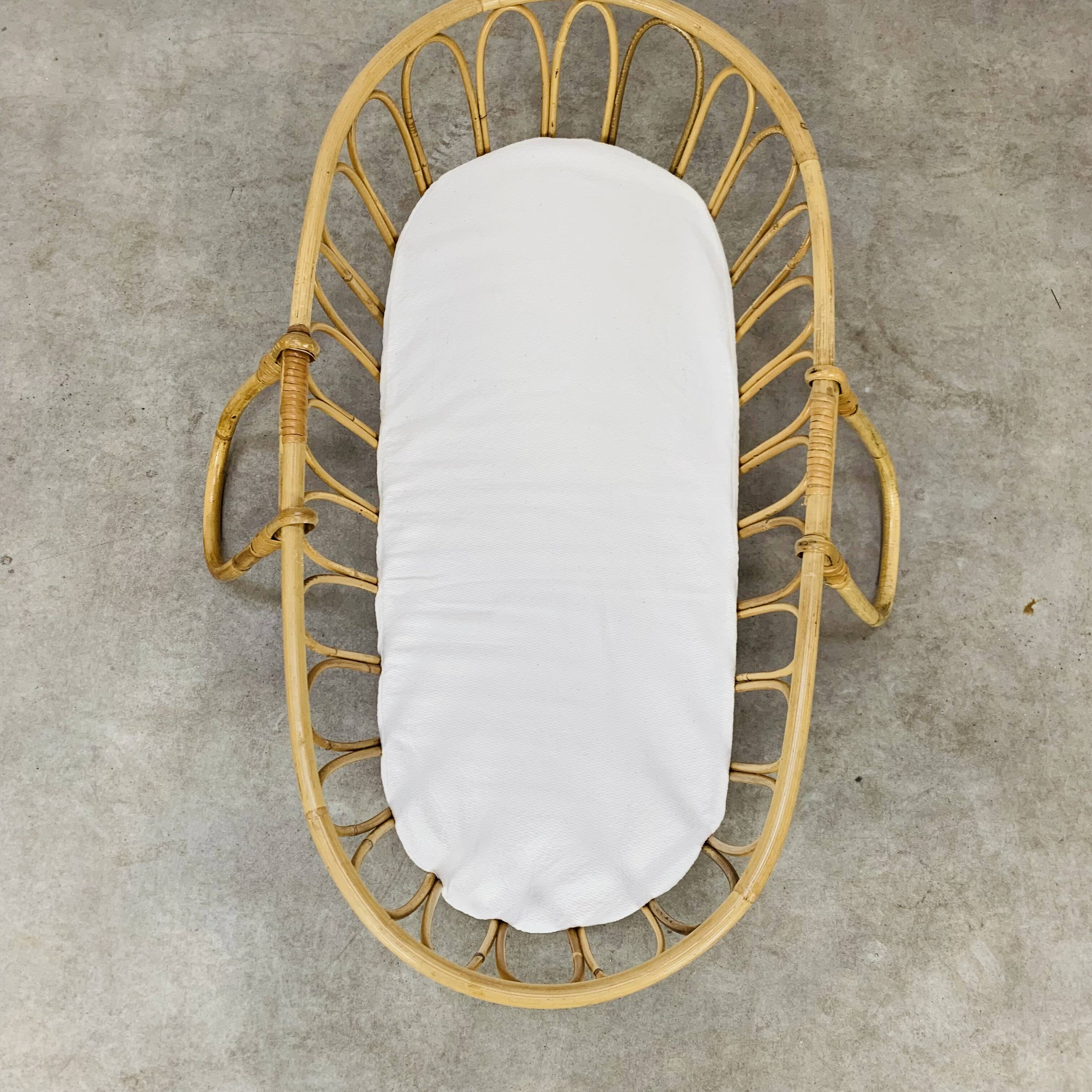 Vintage rattan baby bassinet