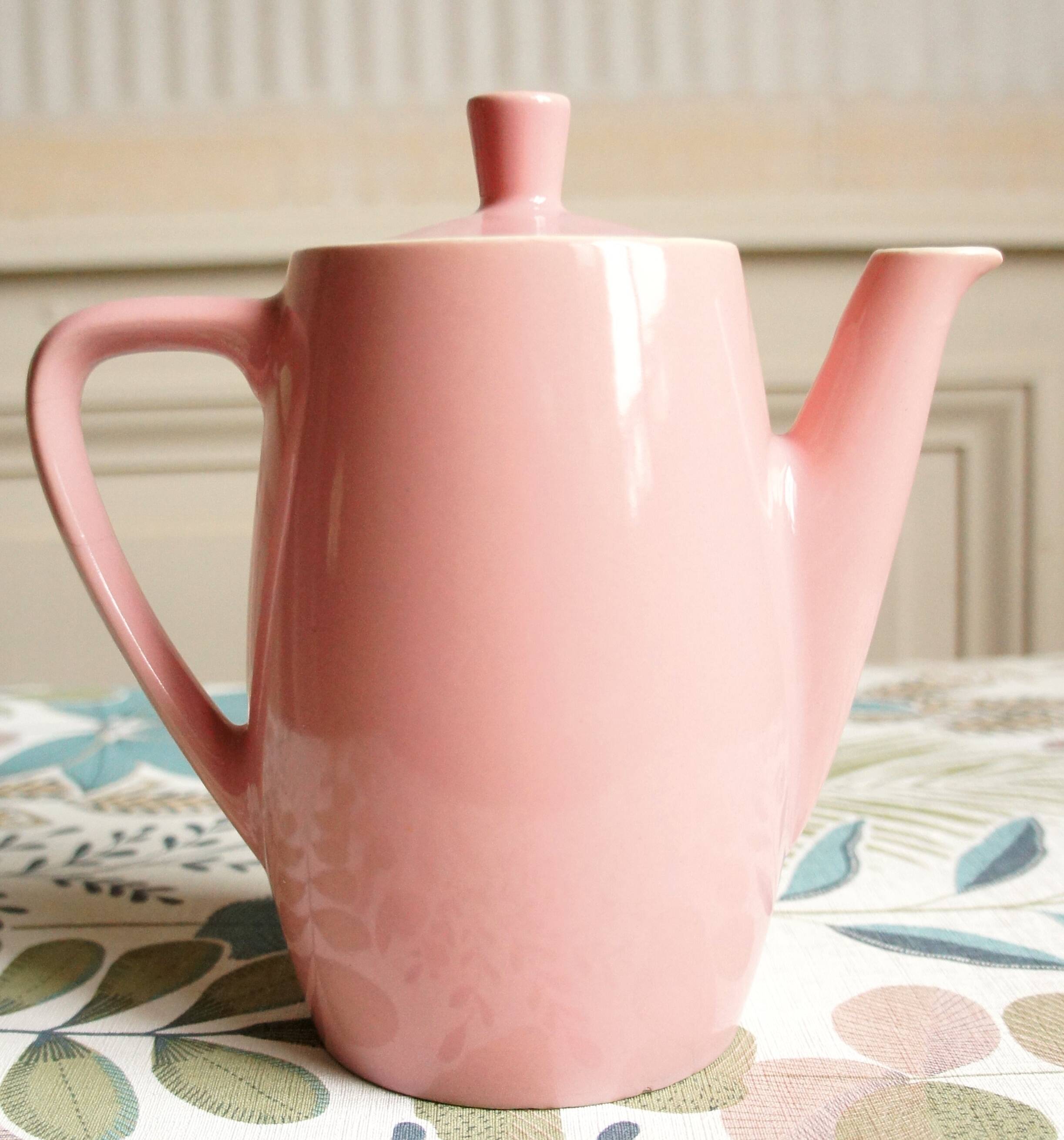 Pink porcelain coffee or teapot