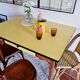 Old wooden farmhouse table and yellow formica top