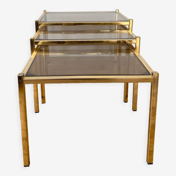 Brass nesting tables and smoked glass