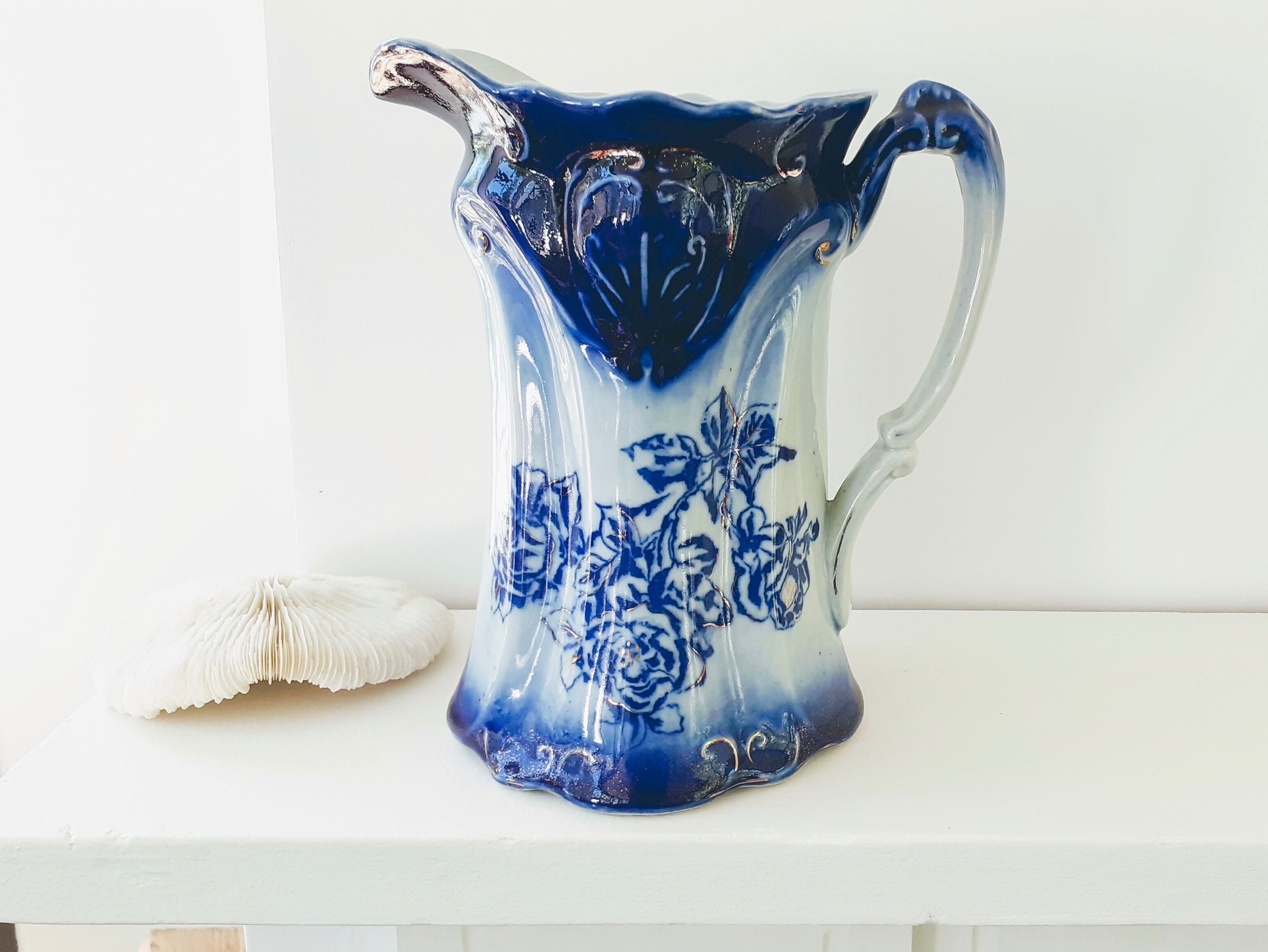 Old pitcher in blue flow, T.Rathbone, England circa 1910