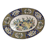 Ceramic dish decorated with peacock folk art Asian motif