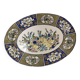 Ceramic dish decorated with peacock folk art Asian motif