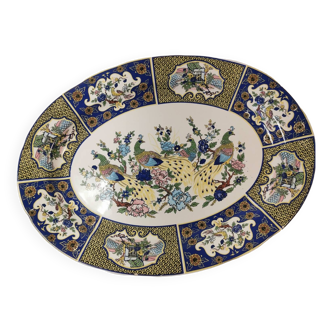 Ceramic dish decorated with peacock folk art Asian motif