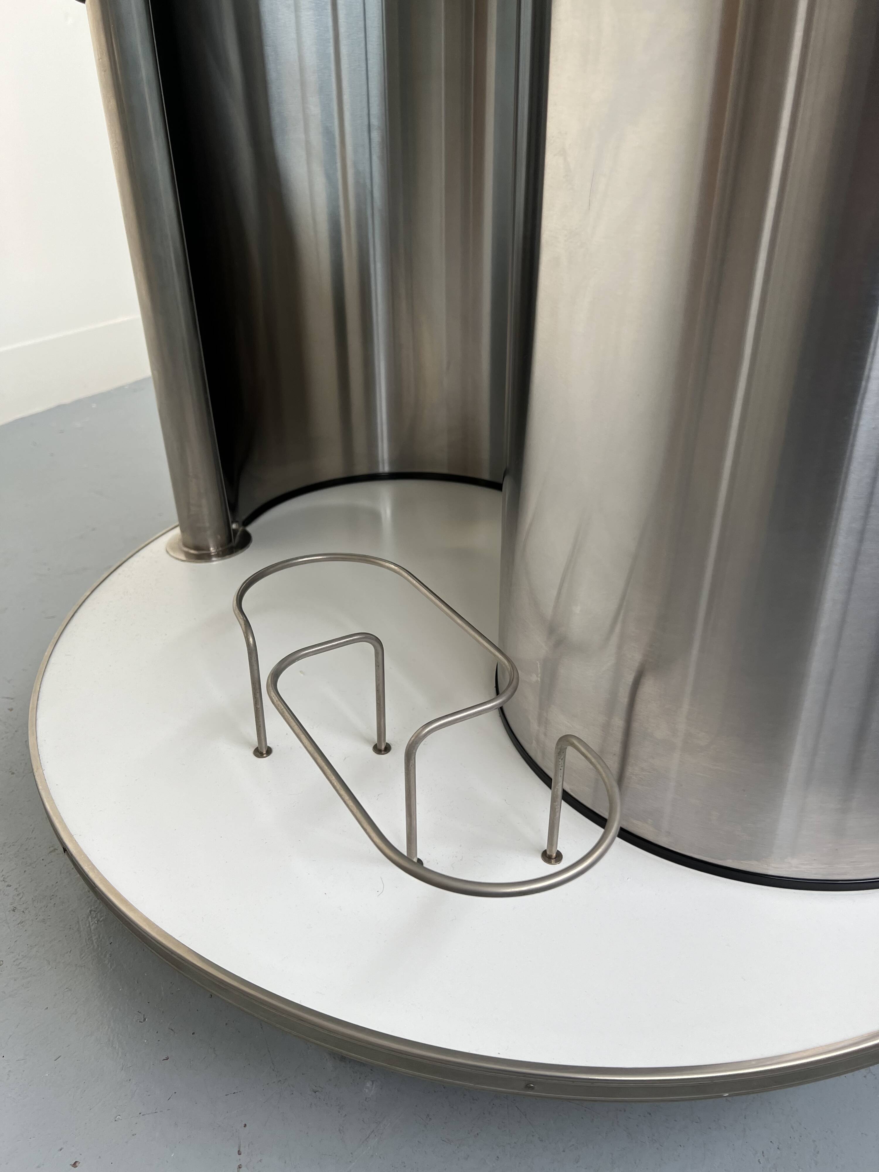 Vintage metal and smoked glass coffee table on casters bar