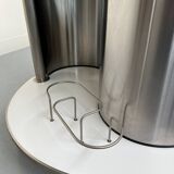 Vintage metal and smoked glass coffee table on casters bar