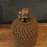 Cylinder glass surrounded by rope