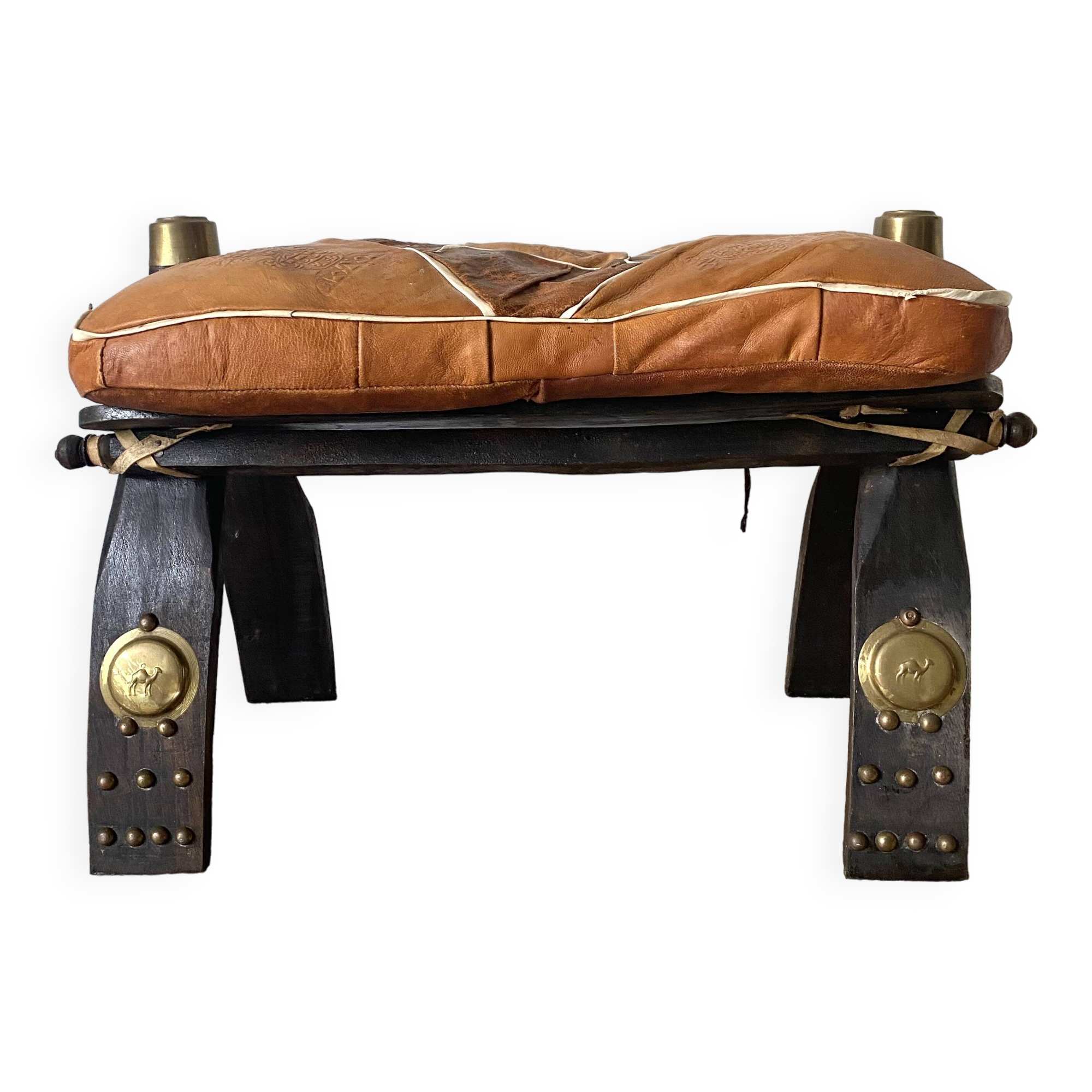 Pair of low Egyptian stools, camel saddles in wood, leather and brass