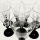 Set of 8 old glasses engraved black feet
