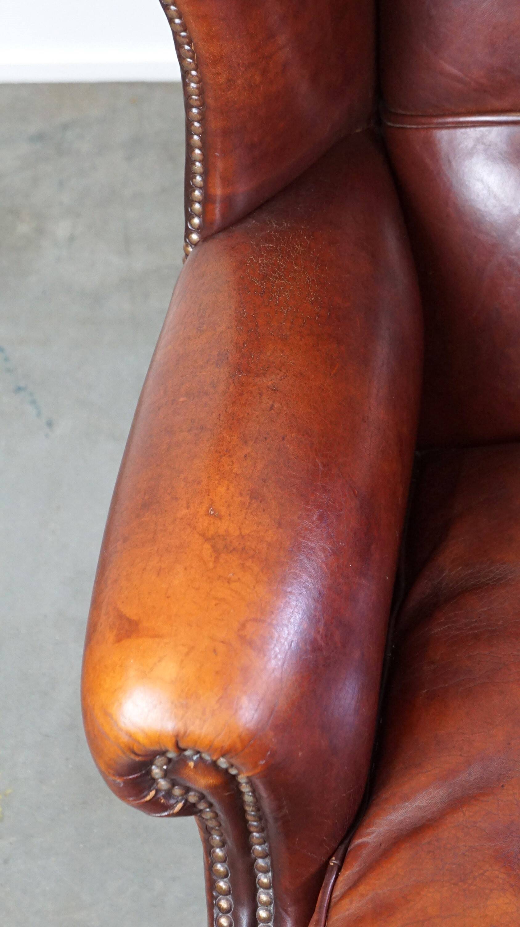 Large comfortable sheepleather wingchair in good condition and beautiful colours