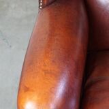 Large comfortable sheepleather wingchair in good condition and beautiful colours