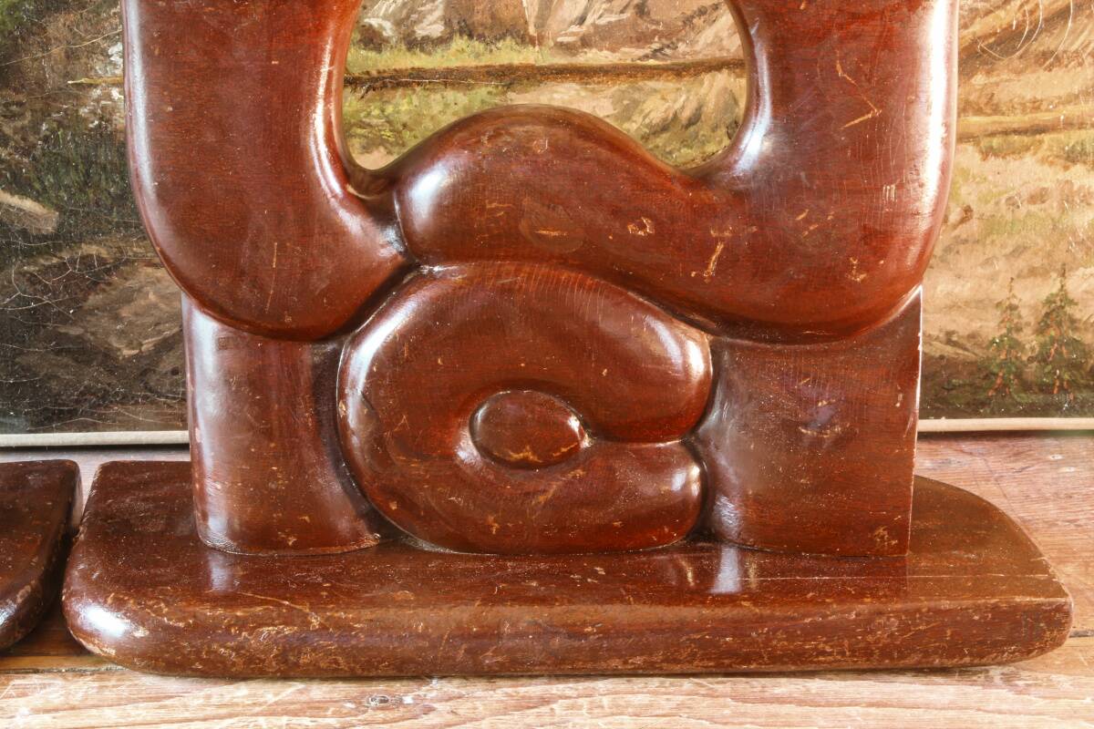 Pair of Art Deco carved wood candlesticks, signed Delaporte