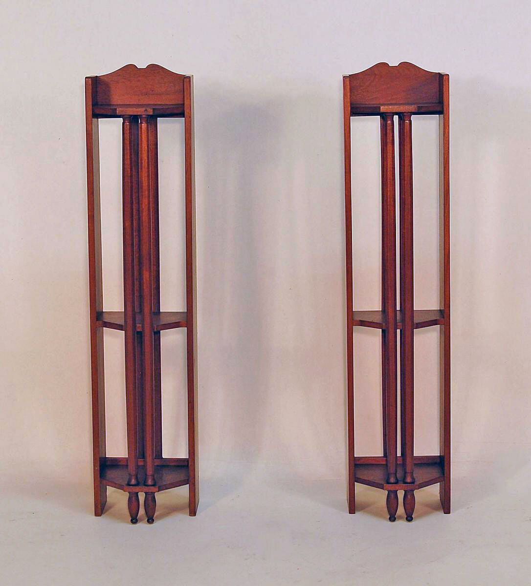 Pair of art deco mahogany wall columns